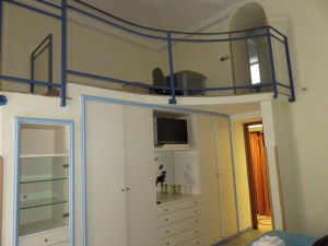 Loft with bed and bath